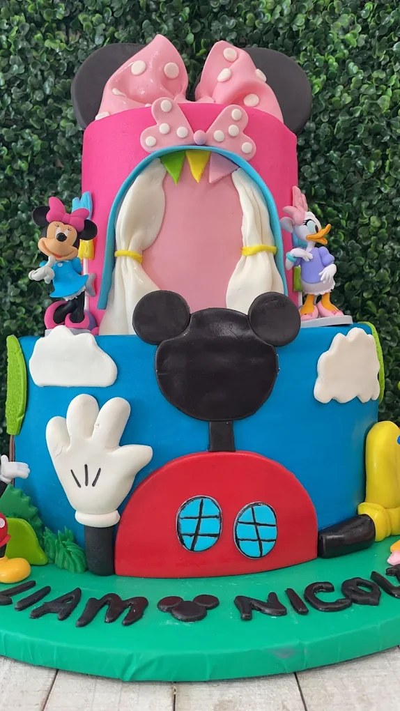 Pink and blue themed tiered cake