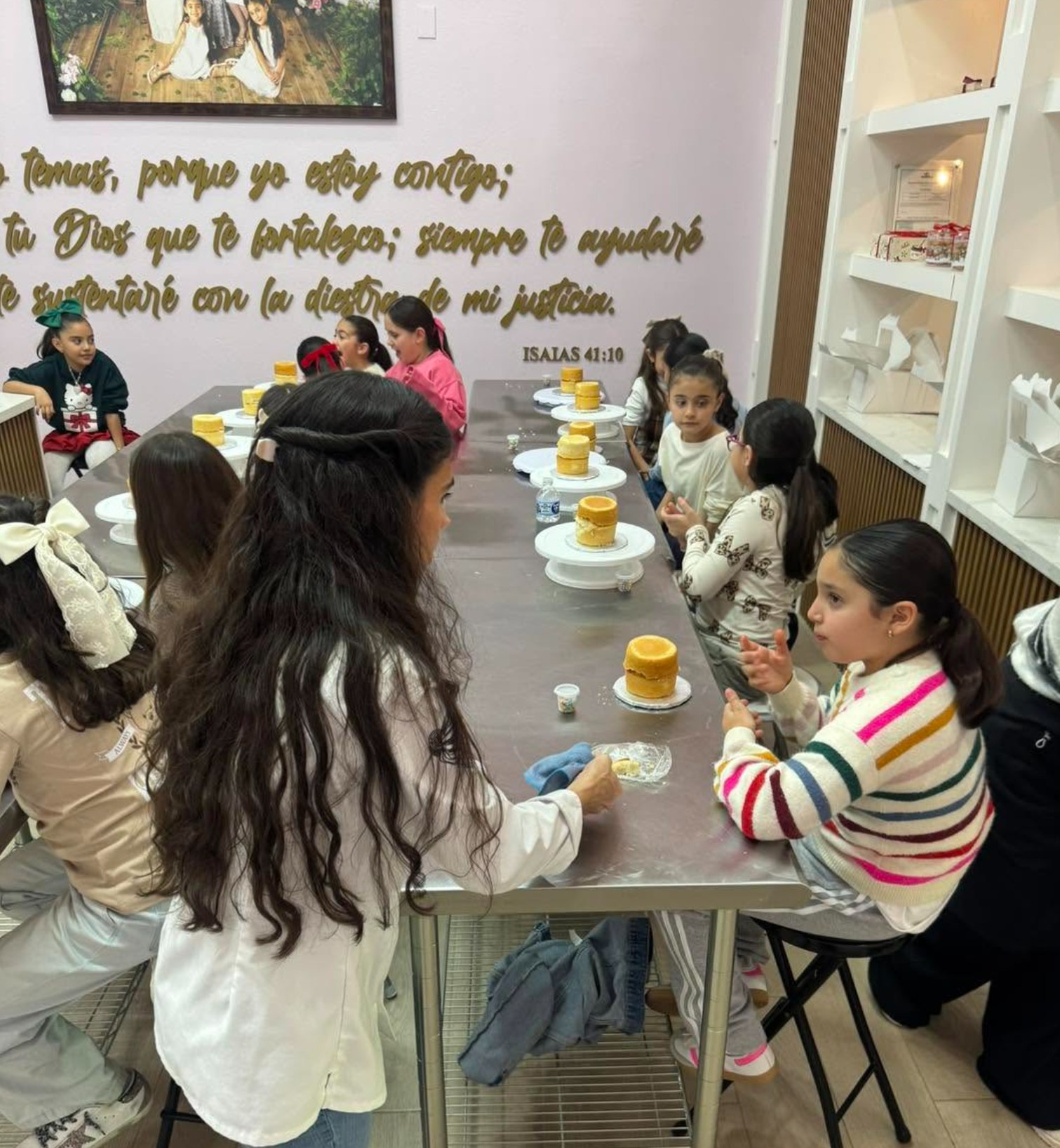 Students learning in a hands-on baking class at Cocina de Herencia
