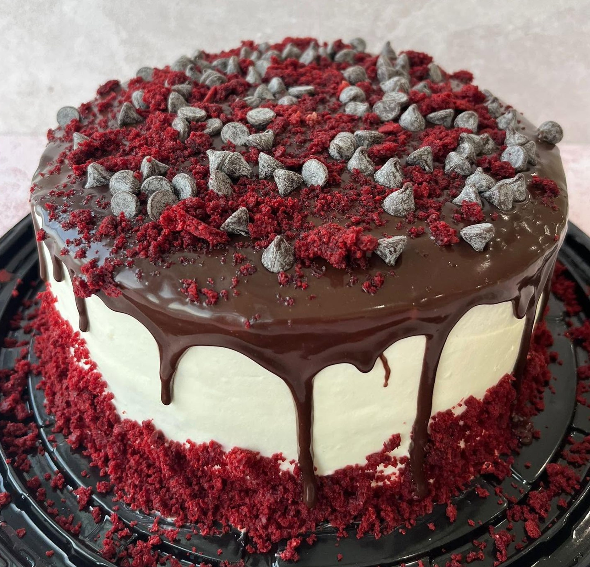 Red velvet crumb and chocolate drip cake